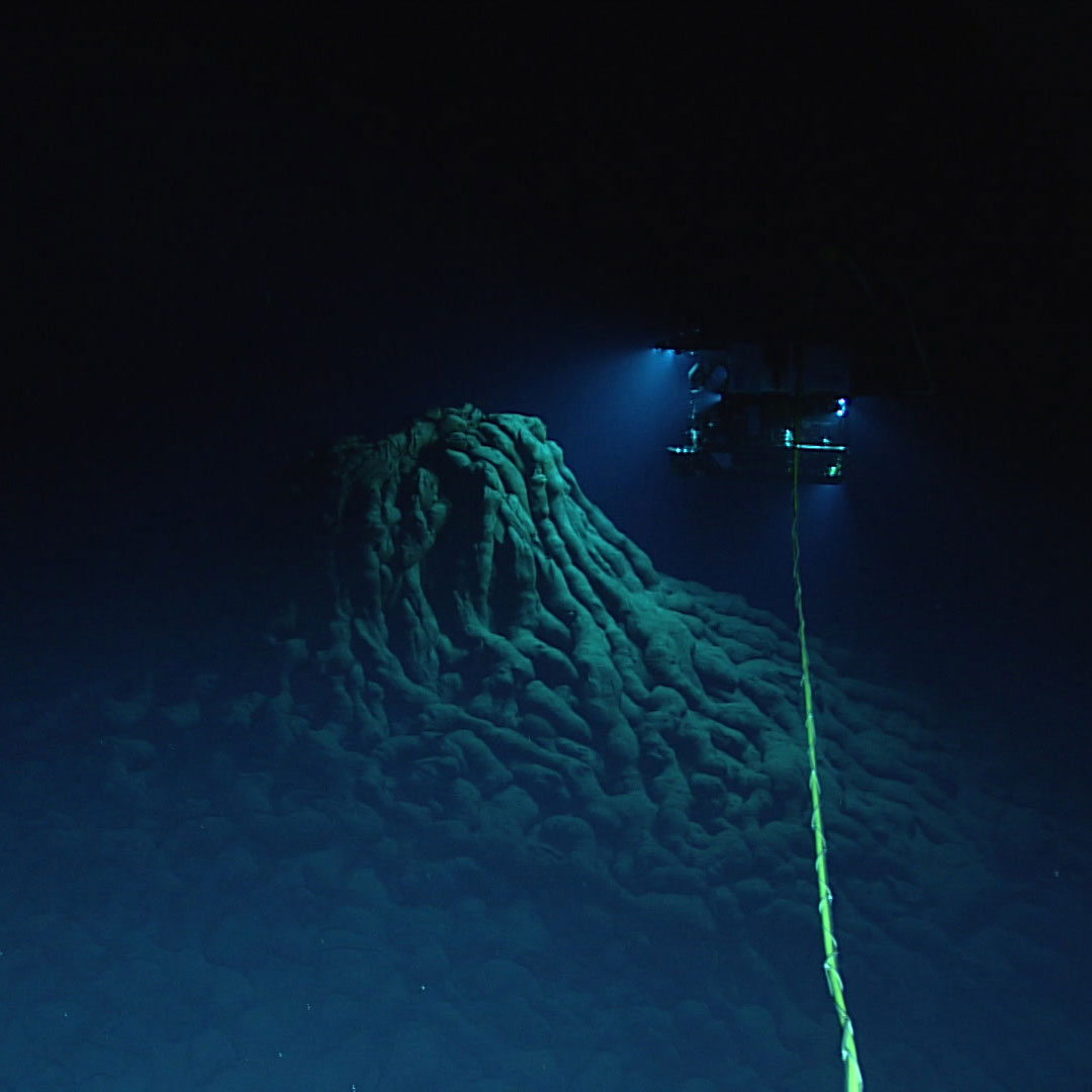 ROV Deep Discoverer explores an eruptive vent at the top of a large mound of pillow lavas.