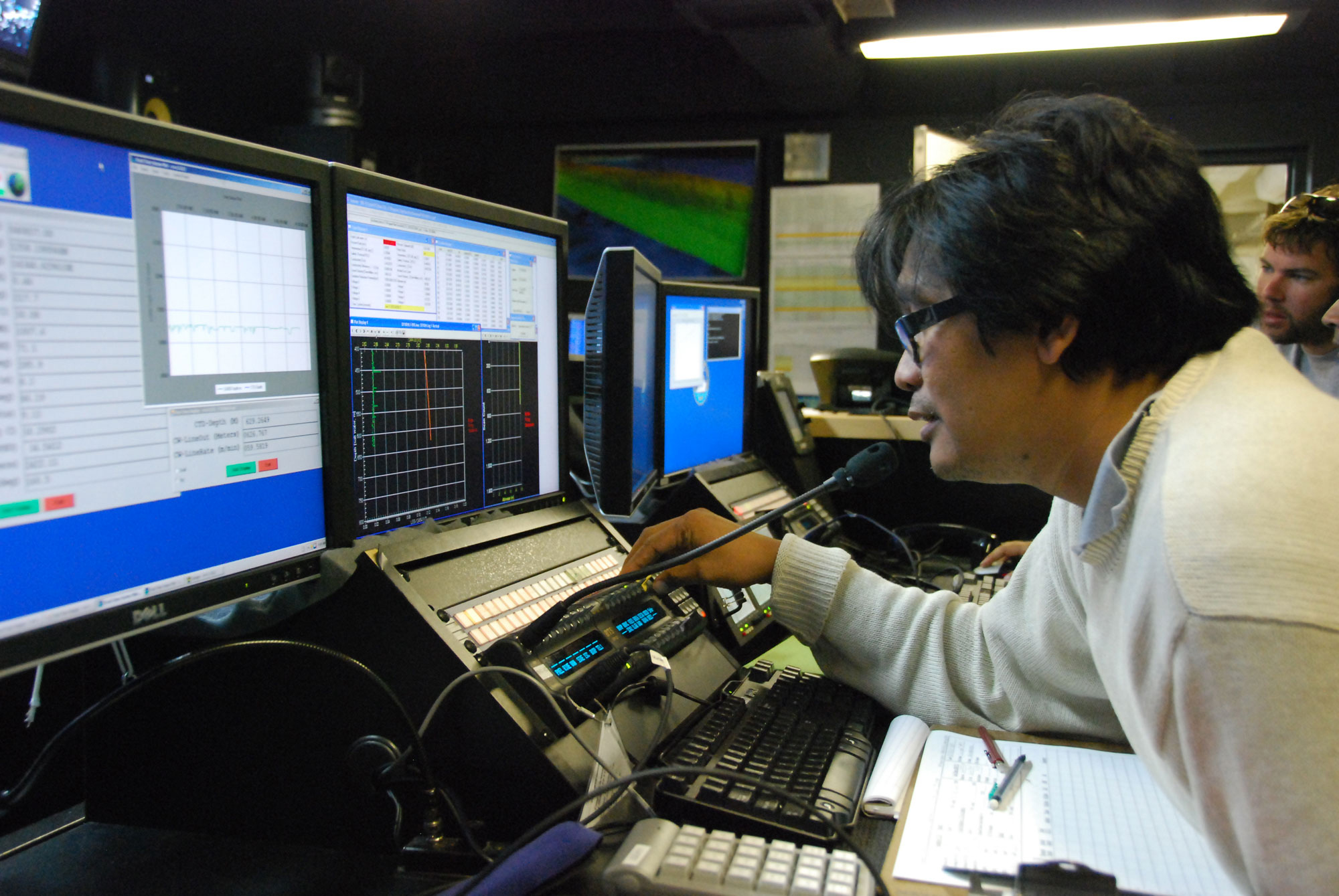 During preliminary operations near Guam, Indonesian scientist Dr. Michael Purwoadi makes the first ‘call’ using telepresence from the NOAA Ship Okeanos Explorer to colleagues in the newly established Jakarta Exploration Command Center.