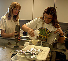 scientists preparing mud cores for later analysis