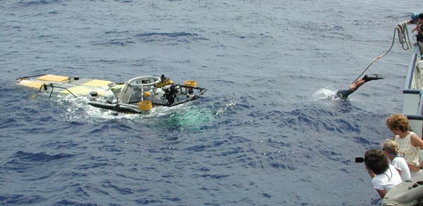 sub crew member Jim Sullivan dives from the R/V Seward Johnson to the JSL II