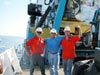 Sonsub technicians victory pose after a successful ROV test dive