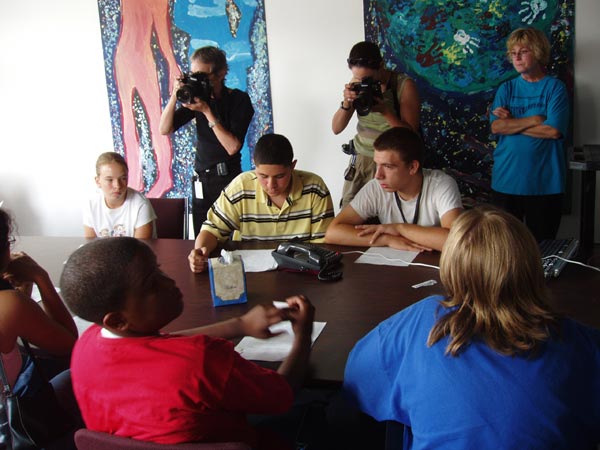 Students at UCAP school in Providence, R.I. talk by satellite phone with NOAA scientist.