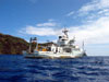 The R/V Thomas G. Thompson holding station over Maug caldera.