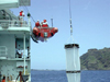 plankton net is being deployed to collect near-surface plankton in Maug caldera