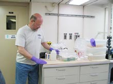 Lance Arnold assists with coral specimens.