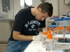 Mercer Brugler prepares coral specimens.