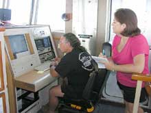 Research Technician Karen Konzen at the microscope specially designed to view fluorescence