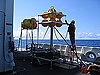 Bruce Cowden secures floatation balls to the frame of a elevator