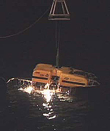 Hercules is lifted from the deck of the ship