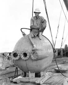 William Beebe sitting on the Bathysphere.