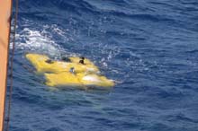 The ROV Hercules is oriented back to back with the ship while the ROV Argus is lifted in to the water