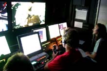 Todd Gregory of the University of Rhode Island (URI) pilots the ROV Hercules, while Alicia Caporaso of URI navigates on the Verrill Seamount.