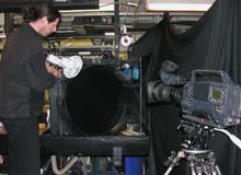 Warwick adjusts the light through the round kreisel tank in preparation for filming mid water animals.