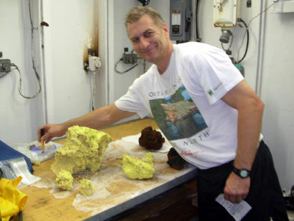 Scientist sort through the geological samples collected at Seamount X.