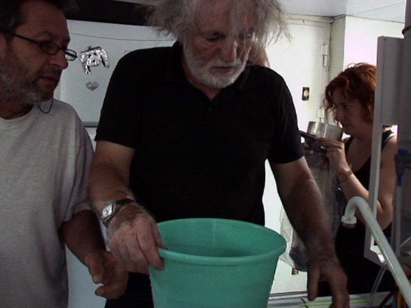 Geologists Andreas Sioulas and Christos Anagnostou prepare to handle rock samples