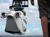 Gavin Eppard pays close attention as the sub is gently lowered into the Gulf of Mexico.