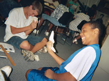 Joseph and Brandon laugh as they analyze artifacts from the USS Cumberland