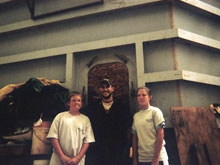 Jacob and Marena pose with one of the conservators who working on the Monitor's Turret.