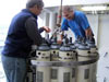 Scientist examine the CTD package before its deployment at Brothers volcano.