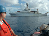 Bosun Group Leader Dave Owen gazes back at the Brown while piloting the ship's RHIB.