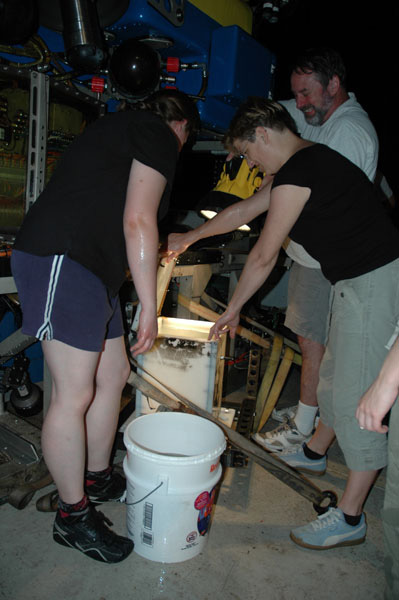 Stephanie Lessard-Pilon and Julia Zekely quickly collect samples 