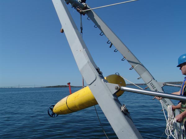 The BPAUV is lifted by an A-frame and placed in the water during Wednesday's calm weather.