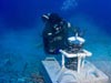 A diver deploying a bottom-mounted Acoustic Doppler Current Profiler (ADCP).