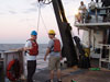 Scientist prepare to help recovery the remotely operated vehicle (under the watchful eye of chief scientist Erik Cordes).