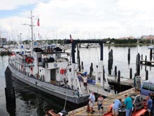 Crew and researchers loading equipment onto research vessel.