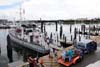 Crew and researchers loading equipment onto research vessel.