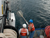 The crew of the R/V LAURENTIAN prepare to deploy a gravity core down 93 meters.