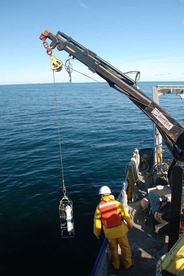 A CTD (conductivity, temperature and depth) sensor is deployed