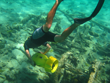 Scientist uses a Diver Propulsion Vehicle (DPV) to explore the Drum Point Wreck.