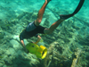 Robert Krieble uses a DPV (Diver Propulsion Vehicle) to explore the Drum Point Wreck. 