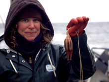 Sarah Minks Hardy holds an octocoral as tall as she is, found in a trawl on September 22. The live, intact specimen helped other scientists aboard identify the pieces of octocoral skeletons they had found in deeper waters in the preceding days.