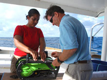 Undergraduate student Alexis Hall helps Dr. Kvitek attach a CTD sensor to the ROV.