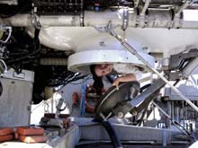 Grad student, Gabby Barbarite, emerges from the aft compartment of the JSL II after her first submersible dive.