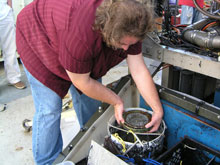 Jake Schidner of West Florida University gingerly retrieves the compass.