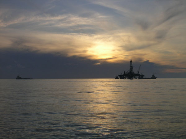 Sunset set the tone for the start of the dive.  Marathon oil platform is highlighted by the spectacular sky.  