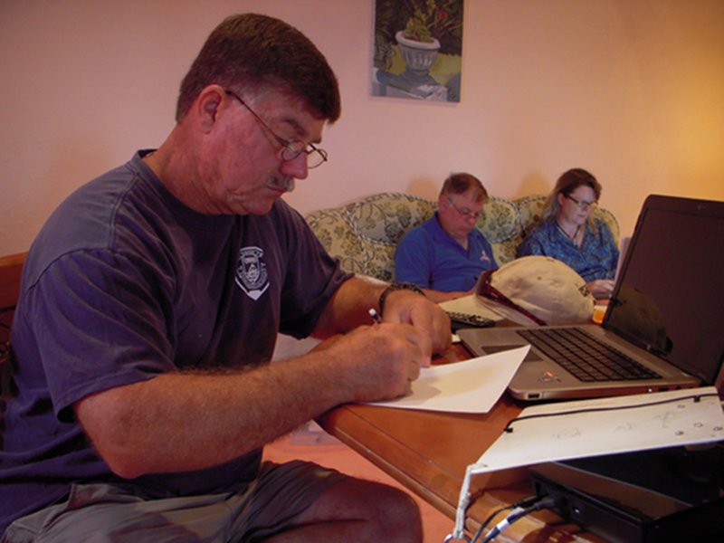 Brian sketching the natural bridge cave back at the cabin.