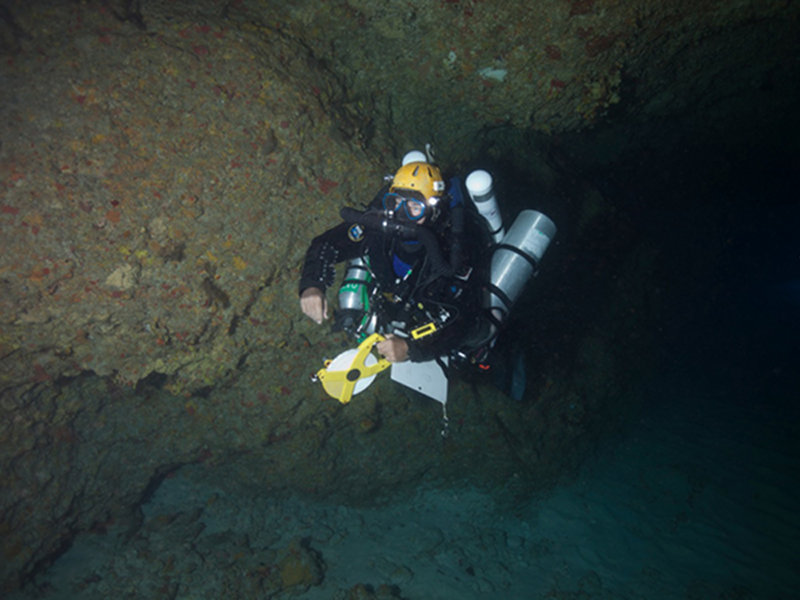 Brian Kakuk making his way back to the boat after measuring the cave and collecting compass headings.