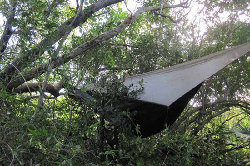 Here, Ed Mallon, chose a spot adjacent to one of the archaeo-logical structures at the site to string his hammock.