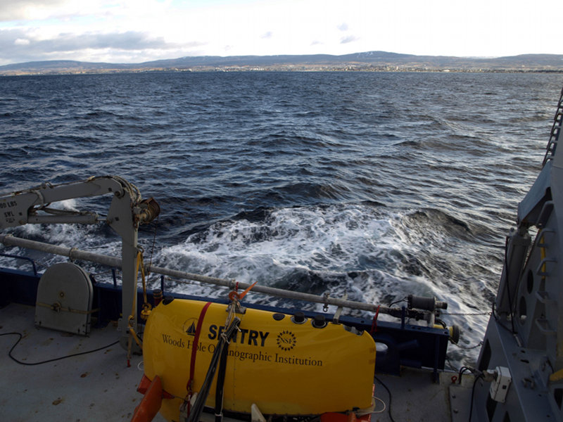 Getting underway. Our first sight as we headed out of port, late afternoon, was a view from the Straits of Magellan over the center of Punta Arenas. Most of the snow on the hills, from 24 hours earlier, has completely melted away.