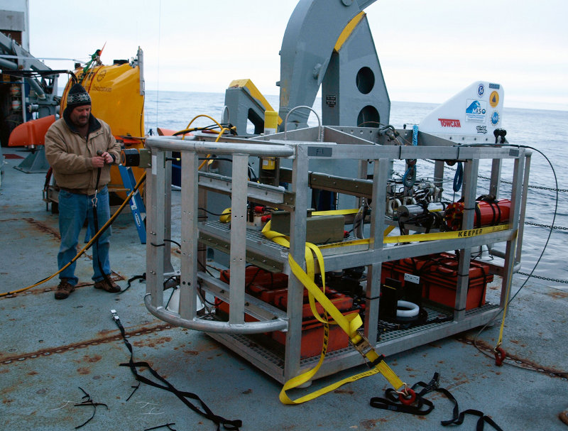 TowCam engineer John making similar final preparations for TowCam. As soon as Sentry is overboard tonight, TowCam will follow fast behind, surveying a different part of the seabed and sending images straight back to the operators aboard ship while Sentry stores its photos on-board its own computers to await return to the ocean surface on Friday.