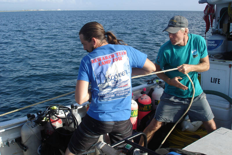 Brian McNamara, left, and Sam Turner, right, haul in on the stern anchor line. We are pulling our anchors and departing for the next target on our list.