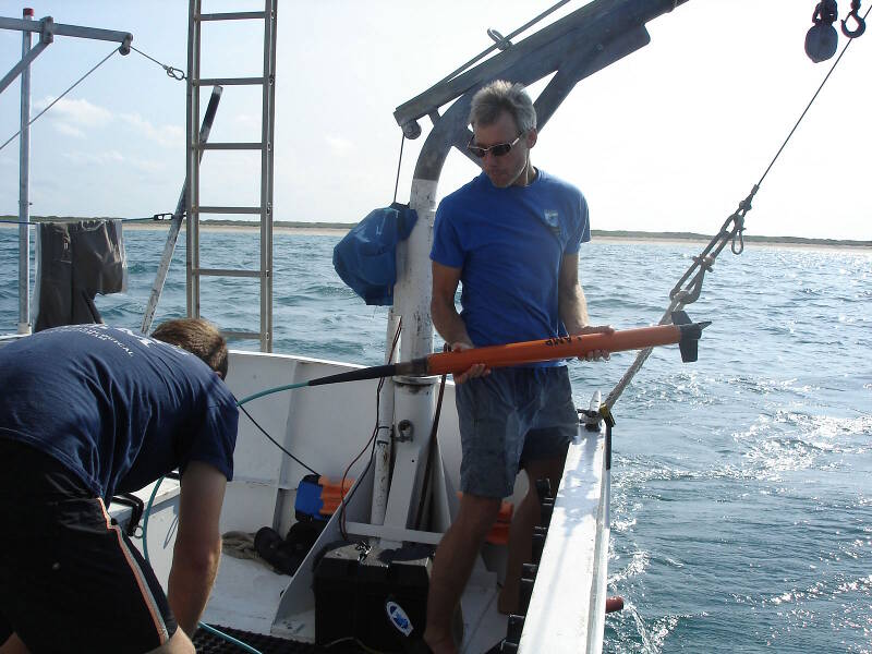 Brendan and Sam prepare to deploy the magnetometer. Sam is holding the mag, a lightweight Explorer model made by Marine Magnetics.