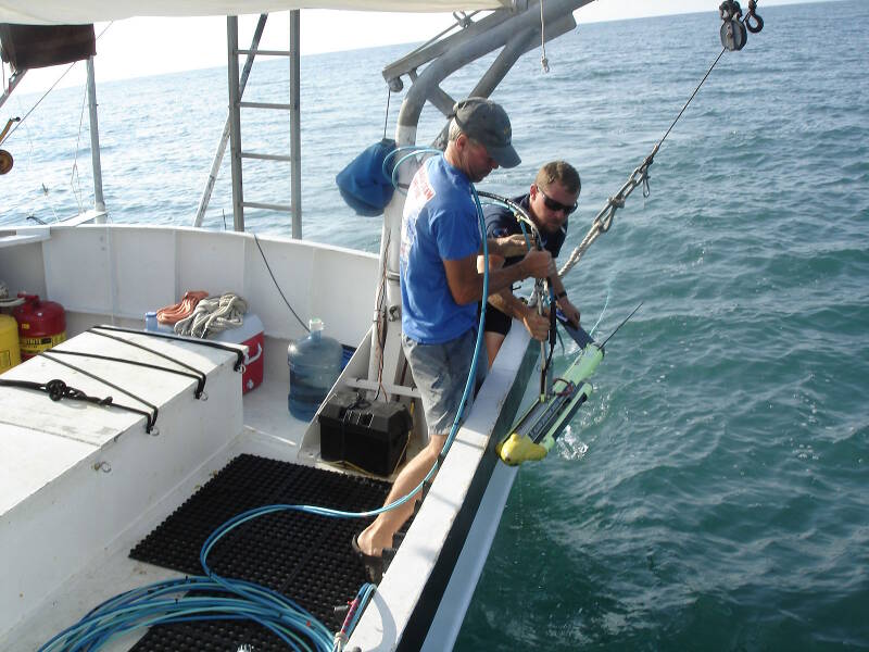 Sam and Brendan pull in the sidescan towfish for the last time.