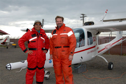 Pilot Rommel Zulueta, San Diego State University, and Robert Schwemmer, West Coast Regional Maritime Heritage Coordinator for NOAA Office of National Marine Sanctuaries, at the airport in Barrow preparing for Seahorse Islands flight in a Sky Arrow 650TCN survey aircraft.