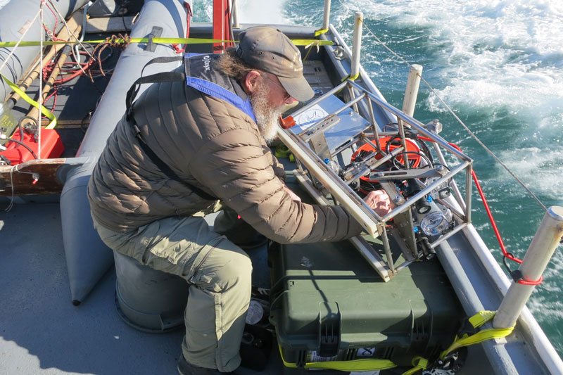 Brad Barr readies the drop camera system for deployment.