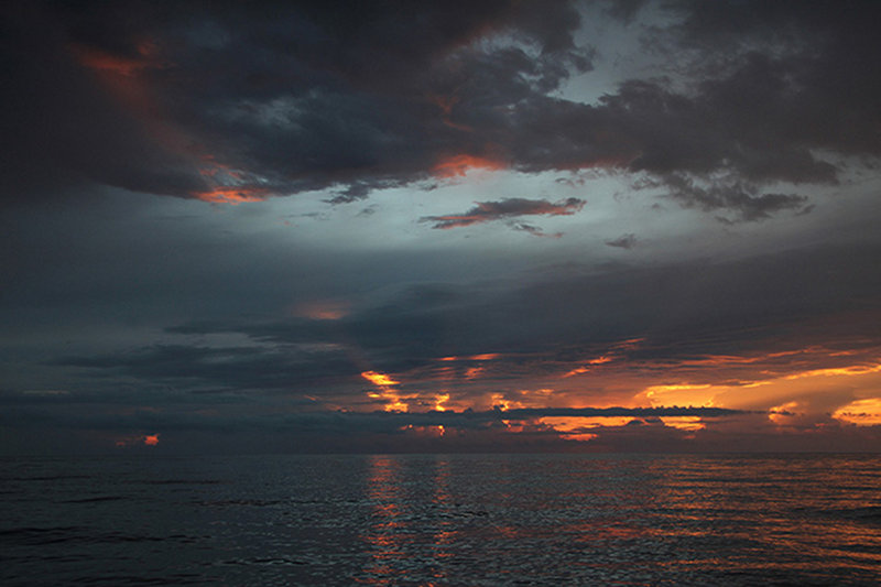 As the R/V F.G. Walton Smith prepared to depart Rebecca Shoal for the return trip to Pulley Ridge, a mixed sky included a beautiful sunset in one direction, heavy clouds and lightening in other directions.